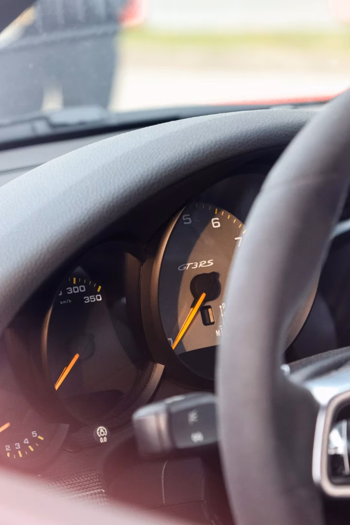 Close-up of a Porsche GT3 RS instrument cluster and steering wheel