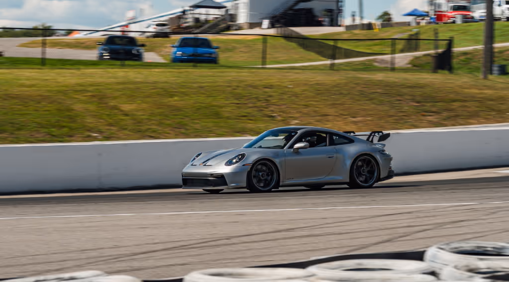 A silver Porsche 911 GT3 on track